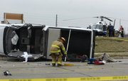Lawrence-Douglas County Fire & Medical responders work the scene of an accident Wednesday at the corner of Bob Billings Parkway and George Williams Way.