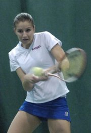 Freshman Magdalena Tokarczyk returns a volley. Tokarczyk's No. 1 singles victory clinched the Jayhawks' match against Oklahoma State on Sunday at First Serve.