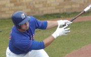 Junior Preston Land takes a stab at a pitch. Land drove in two runs in KU's 10-8 loss to Texas A&M on Sunday at Hoglund Ballpark.