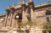 The former Carnegie Library building, shown in this file photo, has been vacant since the Lawrence Arts Center moved to a new location in 2002. The Convention and Visitors Bureau set up offices in the vacated building at 9th and Vermont streets in 2007.
