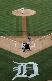 Detroit pitcher Justin Verlander throws the first pitch to Kansas City Royals batter David DeJesus during the first inning of the season opener for both teams. The Royals won, 5-4, in 11 innings, Monday in Detroit.