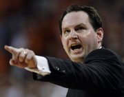 Sean Sutton shouts instructions to his Oklahoma State team in this file photo from OSU's game against Texas on March 9 in Austin, Texas. Sutton resigned under pressure Tuesday.