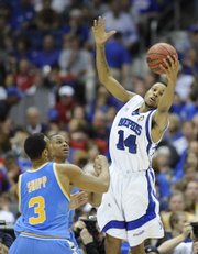 Memphis' Chris Douglas-Roberts skies for a rebound against UCLA in a national semifinal game Saturday.