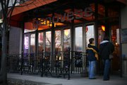 Diners examine a menu outside Genovese, 941 Mass., which replaced the former Mass Street Deli in 2007.