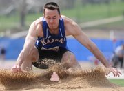 KU's Jacob Breth hits the sand pit after taking a run at the long jump. Breth sits in seventh place after the first day of the decathlon at the Kansas Relays on Wednesday at Memorial Stadium.