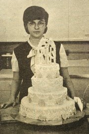 Meri Sprung displays her finished wedding cake project that was featured in a 1965 issue of The Chieftain.
