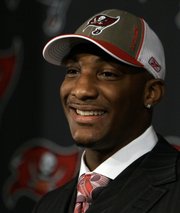 Tampa Bay Buccaneers cornerback Aqib Talib smiles at his introductory news conference. Talib, a former Kansas University All-American, met the media Monday in Tampa, Fla.
