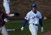 KU's Casey Larson shows his frustration after an at-bat. Despite this bad plate appearance, Larson had three of KU's 16 hits.