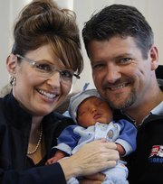 Alaska Governor Sarah Palin and her husband, Todd, hold their baby boy, Trig, in Anchorage, Alaska, in this April 23 file photo. Trig, Palin's fifth child, was born April 18 with Down syndrome.