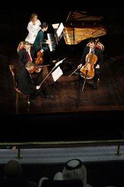 The German-based Artis Piano Quartet perform in front of a mixed gender audience at a government-run cultural center Friday in Riyadh, Saudi Arabia. The concert was Saudi Arabia's first performance of European classical music in a public venue before a mixed gender audience.