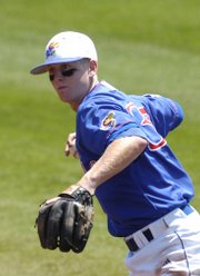 Kansas' Robby Price fields a ground ball and comes up firing. The Jayhawks beat Oklahoma, 9-4, Sunday at Hoglund Ballpark to complete a three-game sweep of the Sooners.