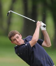 Bishop Seabury Academy freshman Reed Grabill watches his shot from the fairway on the third hole, Monday, May 5, 2008 at Alvamar Golf Course.