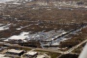 The Baker Wetlands are full of water from heavy rainfall in late March. Thirty-first Street borders the area to the right.