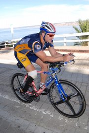 Maj. David Rozelle competes in the bike segment of a recent triathlon. Rozelle lost part of his right leg to a land mine in Iraq, but that didn't stop his competitive drive. The Army officer will compete next month in Lawrence in the Ironman 70.3 Kansas - swimming 1.2 miles, biking 56 miles and running 13.1 miles.