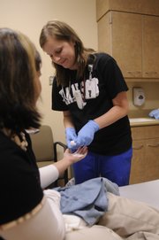 Sarah Martin, an emergency room nurse at Lawrence Memorial Hospital, graduated last year from Washburn University, and after graduation she spend six months in training program at LMH, then she was hired full time in the emergency department.
