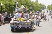 A float sporting a dental hygiene theme makes its way down Massachusetts Street during the Art Tougeau Parade on Saturday, May 17, 2008.