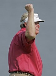 Andy Bean celebrates a birdie putt on the 18th hole of the second round of the Regions Charity Classic. Bean finished 11-under par Saturday in Hoover, Ala.