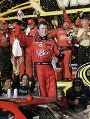 Kasey Kahne celebrates in victory lane. Kahne collected a $1 million prize after winning the NASCAR Sprint All-Star Race at Lowe's Motor Speedway on Saturday in Concord, N.C.