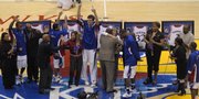 Kansas University seniors, from left, Rodrick Stewart, Jeremy Case, Sasha Kaun, Darnell Jackson and Russell Robinson meet with their parents at mid-court before their Senior Night game against Texas Tech. Case, who red-shirted his first season at KU, graduated last year, and the other four graduate today.