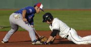 KU's Erik Morrison doesn't quite tag out a K-State baserunner Saturday, May 17, 2008 during the Jayhawks' road game in Manhattan.