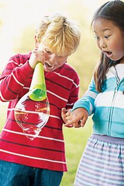Bubble Mania: Dip a plastic drinking straw into the liquid. Insert the end of the straw into the bubble and gently blow. The interior bubbles will pass through the skin at the bottom of the large bubble and cling to the outside.