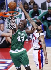 Boston Celtics center Kendrick Perkins (43) dunks on Detroit Pistons center Rasheed Wallace during the first quarter of Game 3. Perkins scored 12 and the Celtics cruised past the Pistons, 94-80, Saturday in Auburn Hills, Mich.