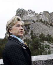 Presidential hopeful Sen. Hillary Rodham Clinton, D-N.Y., visits the presidential carvings at the Mount Rushmore National Monument, near Keystone, S.D., on Wednesday as she campaigns in South Dakota. The presidents carved into the mountain are, left to right, George Washington, Thomas Jefferson, Theodore Roosevelt and Abraham Lincoln.