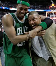 Boston Celtics forward Paul Pierce (34) hugs coach Doc Rivers after the Celtics defeated the Detroit Pistons, 89-81, to win the Eastern Conference finals. The Celtics advanced to the NBA finals with the victory Friday in Auburn Hills, Mich.