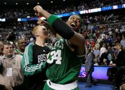 Boston's Paul Pierce, right, celebrates the Celtics' 89-81 victory over Detroit in Game 6 of the Eastern Conference finals. The Celtics clinched the series Friday night in Auburn Hills, Mich., to earn a date with the Los Angeles Lakers.