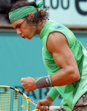 Spain's Rafael Nadal celebrates after winning a point against Nicolas Almagro. Nadal won the French Open quarterfinal match, 6-1, 6-1, 6-1, on Tuesday in Paris.