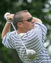 Former Kansas University golfer Chad Roesler tees off. He and teammate Conrad Roberts were eliminated in the first round of match play at the Kansas Golf Association Four-Ball Championship on Thursday at Alvamar.