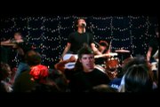 Dylan Hilpman, center right, sings while Kansas City band The Architects performs in the background.