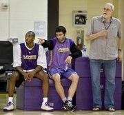 Los Angeles Lakers, from left, Kobe Bryant, Vladimir Radmanovic and coach Phil Jackson, look on during practice. The Lakers tuned up Saturday in El Segundo, Calif.