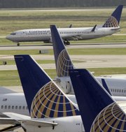 A Continental Airlines jet lands at George Bush Houston Intercontinental Airport in Houston in this June 5 file photo. Air travel is expected to change as airlines struggle with skyrocketing fuel prices.