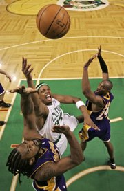 Boston's Paul Pierce, center, shoots over Los Angeles' Ronny Turiaf and Kobe Bryant. Pierce was named MVP of the NBA Finals after the Celtics defeated the Lakers, 131-92, in Game 6 on Tuesday in Boston.