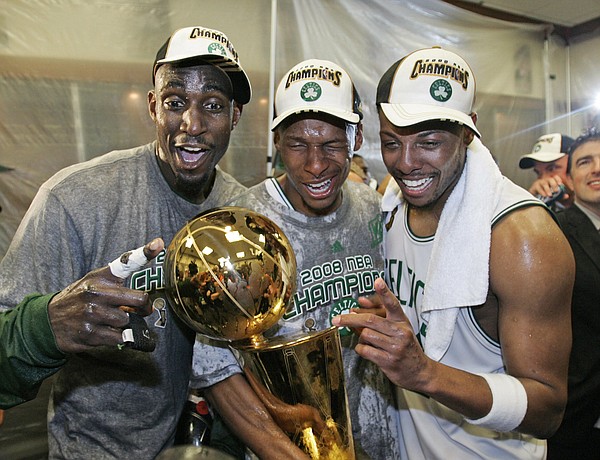 Boston's Kevin Garnett, left, Ray Allen, center, and Paul Pierce celebrate in the locker room. The Celtics clinched their 17th NBA title Tuesday in Boston.