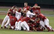 Fresno State players celebrate their College World Series victory over Georgia. Fresno State defeated Georgia, 6-1, on Wednesday in Omaha, Neb.