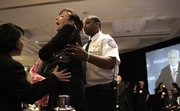 An unidentified war protester yells during a speech by Republican presidential candidate Sen. John McCain, R-Ariz., to the National Association of Latino Elected Officials meeting Saturday in Washington.