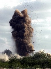A pall of smoke and debris rises from the ground during a bombardment by Pakistan's paramilitary force, using heavy artillery to bombard hideouts of suspected militants during a crackdown operation Saturday in Bara Akakheil in Pakistan's tribal area of Khyber. Pakistani forces bombarded suspected militant hideouts Saturday at the start of a major offensive against Taliban fighters threatening the main city in the country's volatile northwest, officials said.