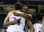Sasha Kaun, left, and Darnell Jackson congratulate each other after KU's victory against Villanova in the Sweet 16 of the NCAA Tournament in Detroit. Both former KU post men were selected in the second round of the NBA Draft last week in New York. After a few trades, Kaun and Jackson will have the chance to be teammates again in Cleveland.