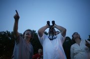 Astronomy Associates of Lawrence members search for planets during a gathering at South Park, 1200 Mass.