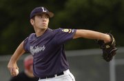 Raiders' Travis Spurling unwinds a pitch Wednesday, July 9, 2008 during Lawrence's baseball game against the Topeka Capitals at Ice Field.