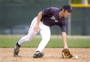 Lawrence Raiders' shortstop Hunter Scheib scoops up a grounder Wednesday during their doubleheader against the Topeka Capitals at Ice Field.