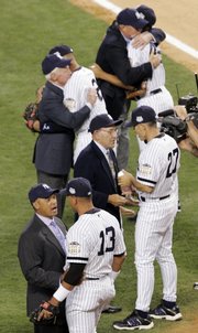 New York Yankees' Alex Rodriguez (13) chats with Reggie Jackson, while Yankees manager Joe Girardi (27) talks to Yogi Berra during opening ceremonies for Tuesday's All-Star game at Yankee Stadium.