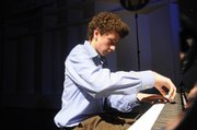 Dominic Cheli, of St. Charles, Mo., takes his turn during a sound check Tuesday afternoon at the Lied Center. He was one of four young prodigies performing piano pieces for National Public Radio&squot;s show "From the Top."