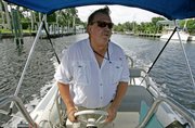 James Hedrick, an agent for National Liquidators, talks to a reporter as he heads out to a vessel repossession in Fort Lauderdale, Fla. National Liquidators, the world's largest marine repo service, takes possession of about 200 boats a month in Florida, Ohio and California.