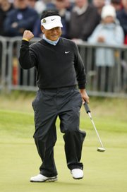 K.J. Choi reacts after his birdie on the 18th hole to take the lead during the second round of the British Open on Friday at Royal Birkdale in Southport, England. Choi has a one-shot lead going into the third round today.