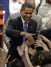 Democratic presidential candidate Sen. Barack Obama, D-Ill., greets supporters after speaking at a town hall meeting Friday in St. Petersburg, Fla.