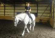 Rebecca Rigdon, of Lawrence, practices with Solei, a mid-level dressage horse, at Freedom Hill Farm in Olathe. Rigdon has trained with Steffen Peters, who is a member of the U.S. Olympic dressage team.
