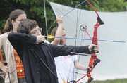Preston Foster,11, Tonganoxie, tests his skills at an archery class at Prairie Park Nature Center, 2730 S.W. Harper St. The center recently began offering the classes.